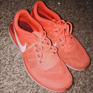 pinky/orange nike shoes!